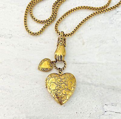 #ad 1928 Hand Holding Charms and Engraved Heart Locket Necklace 27quot; Long Gold Tone $61.20