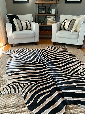 #ad Zebra Cowhide Rug Average Size: 7#x27; X 7#x27; Genuine Zebra Print Brown Inner Stripes $249.00