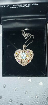 #ad sterling 925. Filigree heart locket with real gemstones 600.00 retail $190.00
