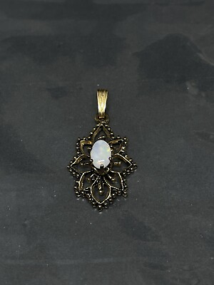 #ad Vintage Gold Tone Open Work Filigree Flower Oval Opal? Center Pendant 1” $25.00