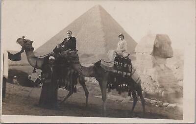 #ad RPPC postcard Sahara Desert Couple Riding Camels in front of Pyramids 1900s $40.00