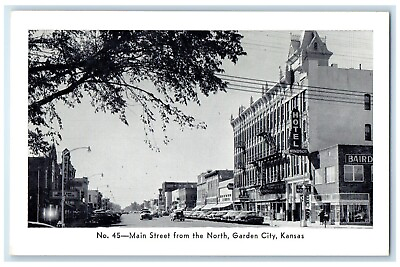 #ad c1940 Main Street North Exterior Road Classic Cars Garden City Kansas Postcard $29.95